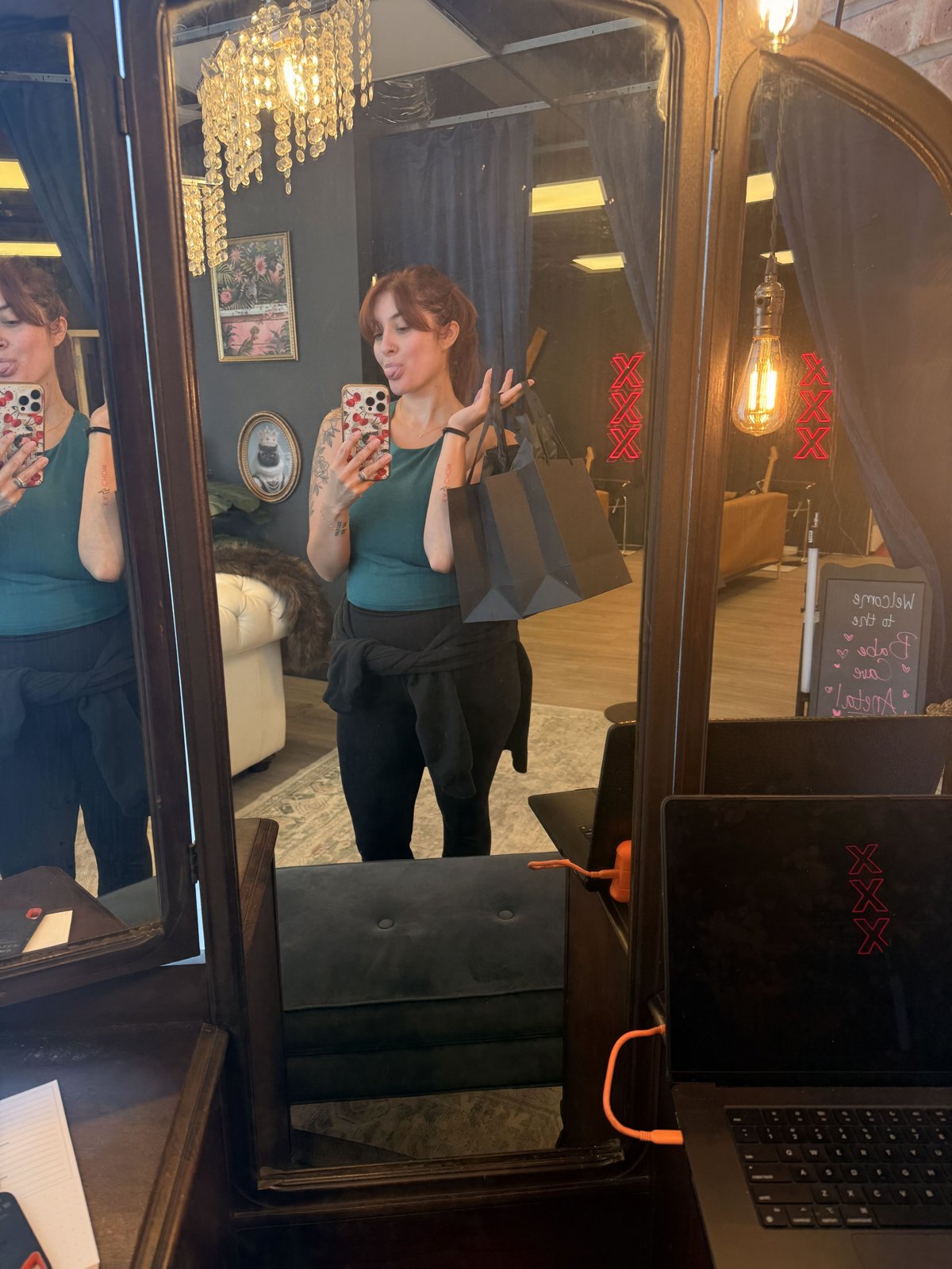 Bri Valiente taking a mirror selfie at the glam vanity in her Chicago boudoir studio