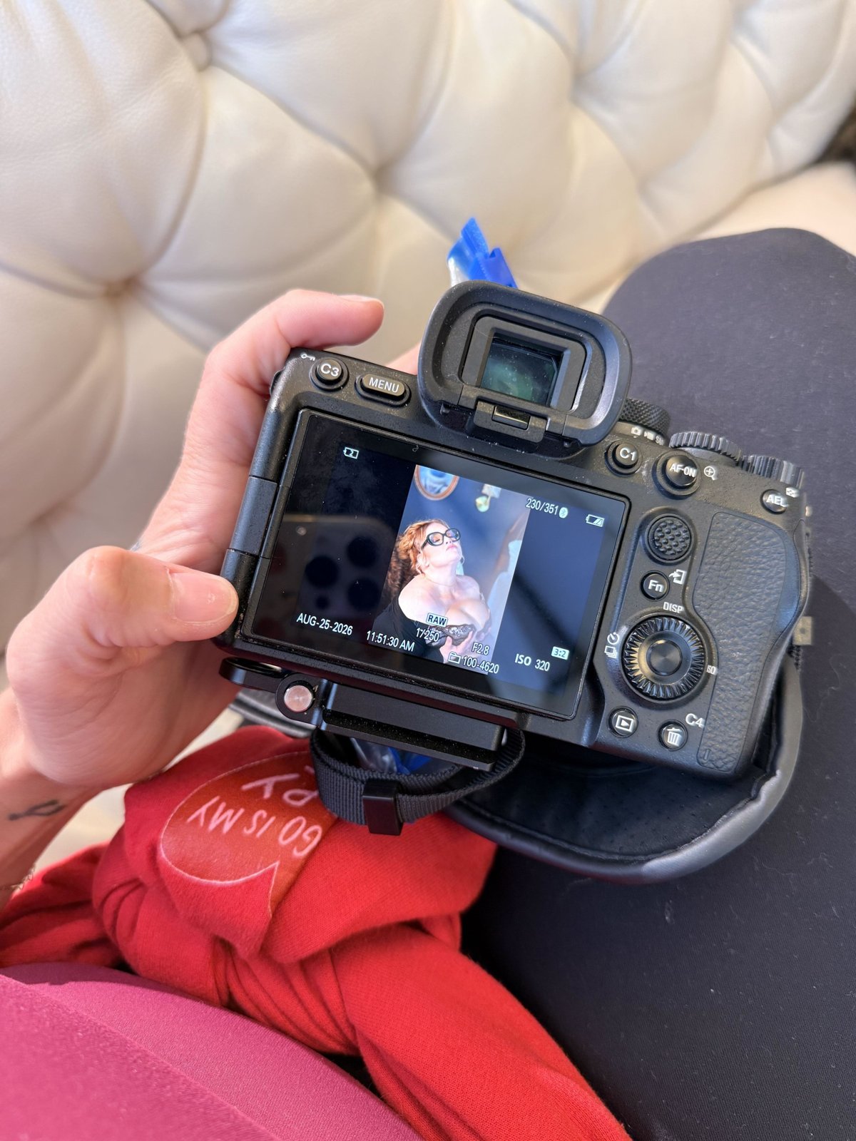 Bri showing a client her image on the back of the camera mid session