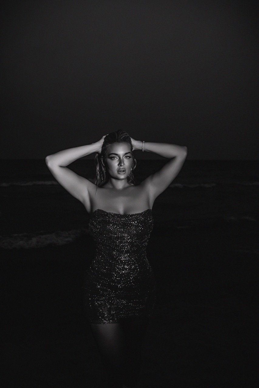Chicago editorial boudoir shoot by Bri Valiente Boudoir featuring a woman in a sparkly dress on the Lake Michigan beach at night